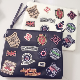 Badge leather clutch