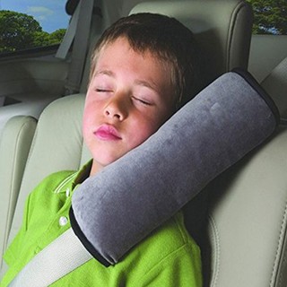 Baby head restraint attaches seat belts (1)
